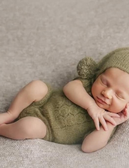 Romper and hat with pompom for a Newborn photo shoot